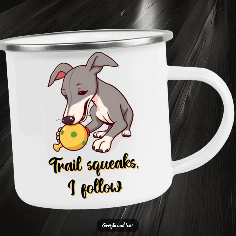 Funny camping mug showcasing a greyhound enthusiastically nudging a squeaky toy, ideal for outdoor fun.