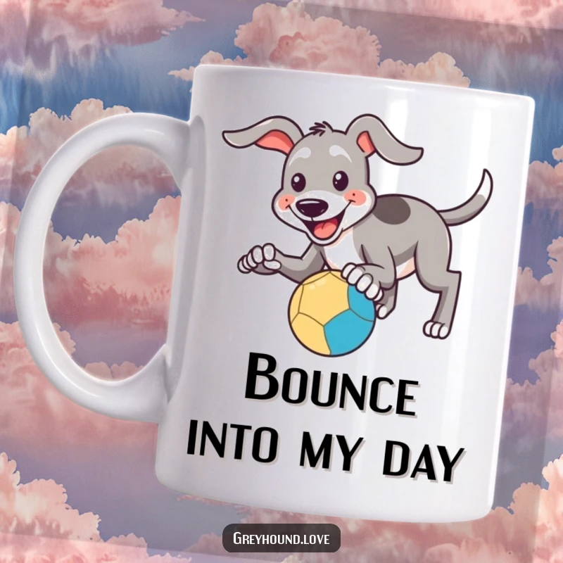 Funny Mug: A happy greyhound smiles and attempts to catch a bouncing ball with its paws, showcasing playful effort.