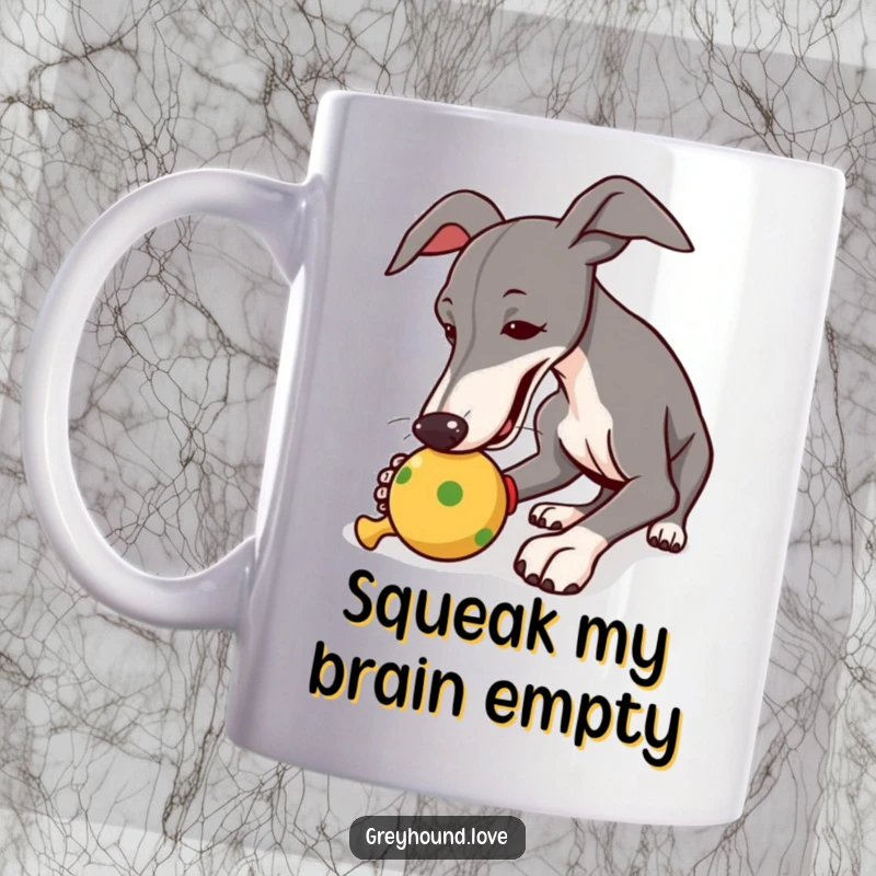 Funny mug with a greyhound playfully nudging a squeaky toy, capturing pure canine delight and excitement.