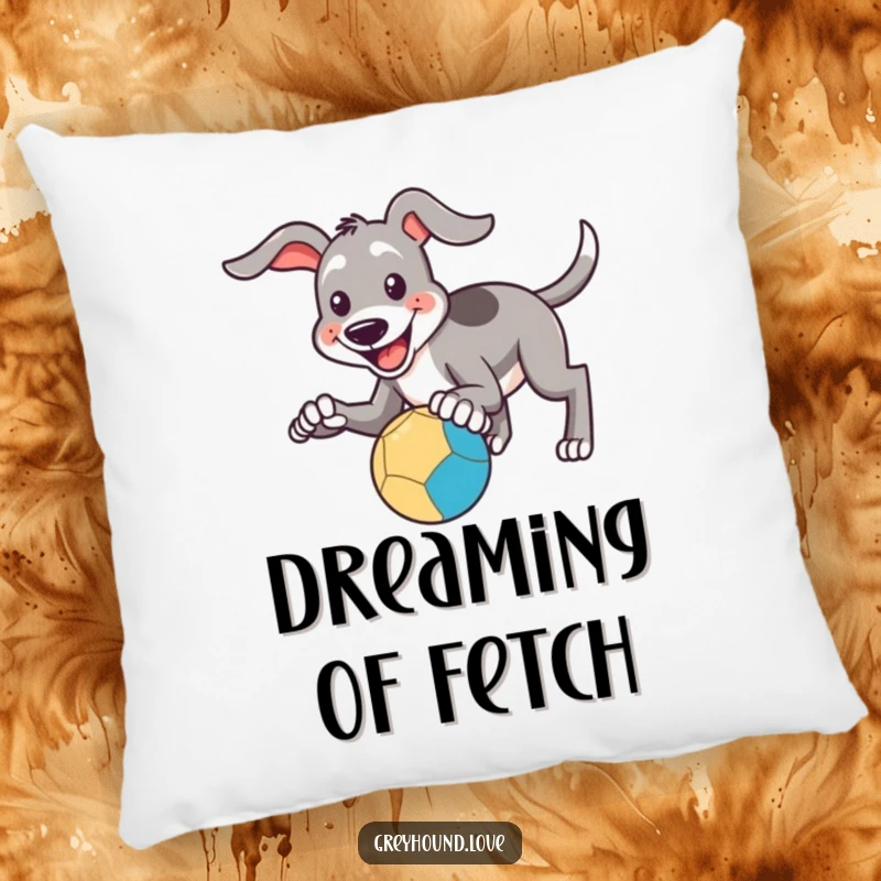 Funny Pillow: A soft pillow depicting a smiling greyhound attempting to catch a bouncing ball with its paws, very cute.