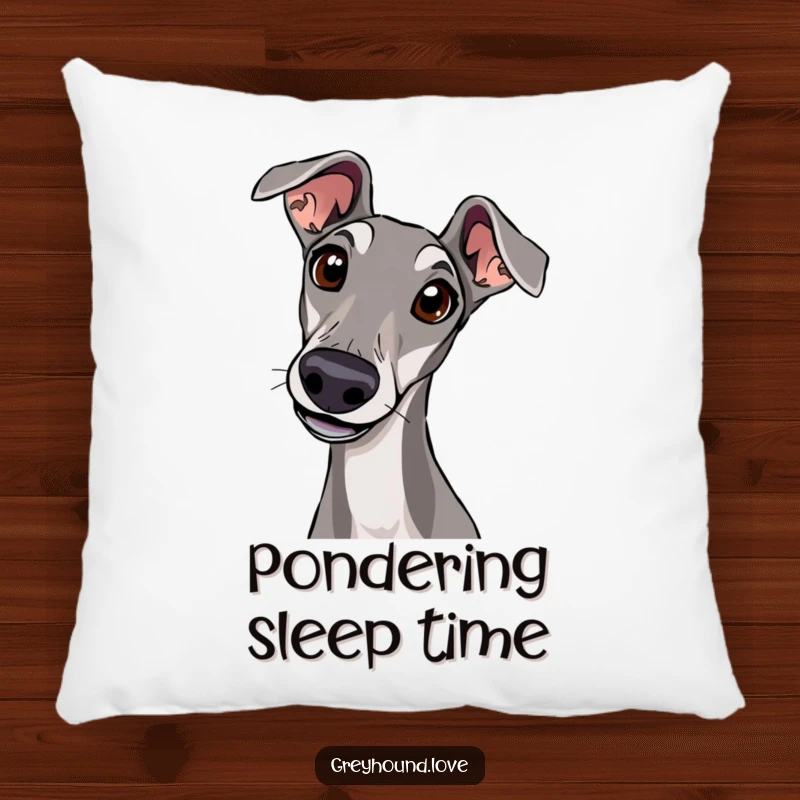 A soft pillow adorned with a greyhound tilting its head with wide, curious eyes, offering cozy comfort.
