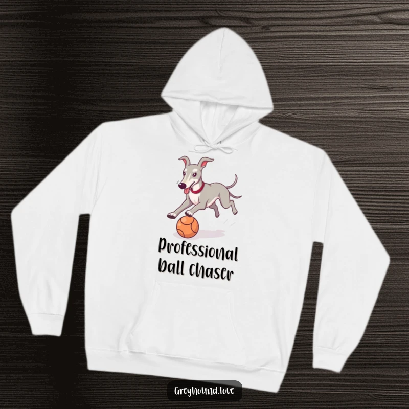 Funny Greyhound Hoodie depicting a joyful dog joyfully chasing a ball, designed for laughs and warmth.