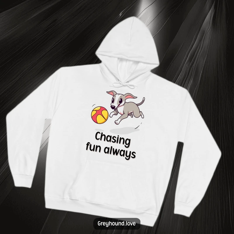 A warm hoodie featuring a greyhound playfully chasing a colorful bouncing ball, full of energy.