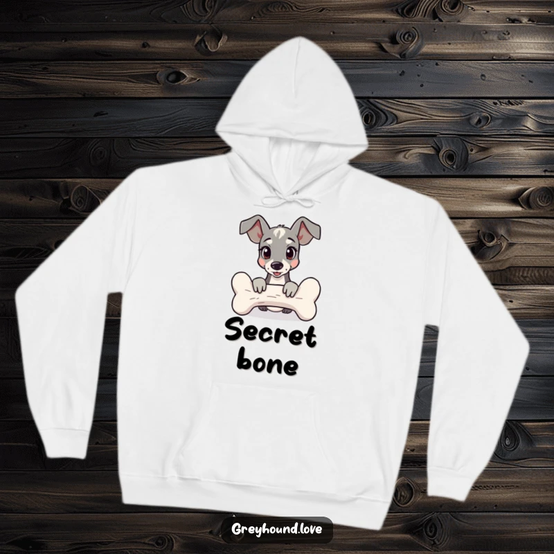 Funny Hoodie illustrating a greyhound peeking mischievously from behind a giant bone, designed for warmth and humor.