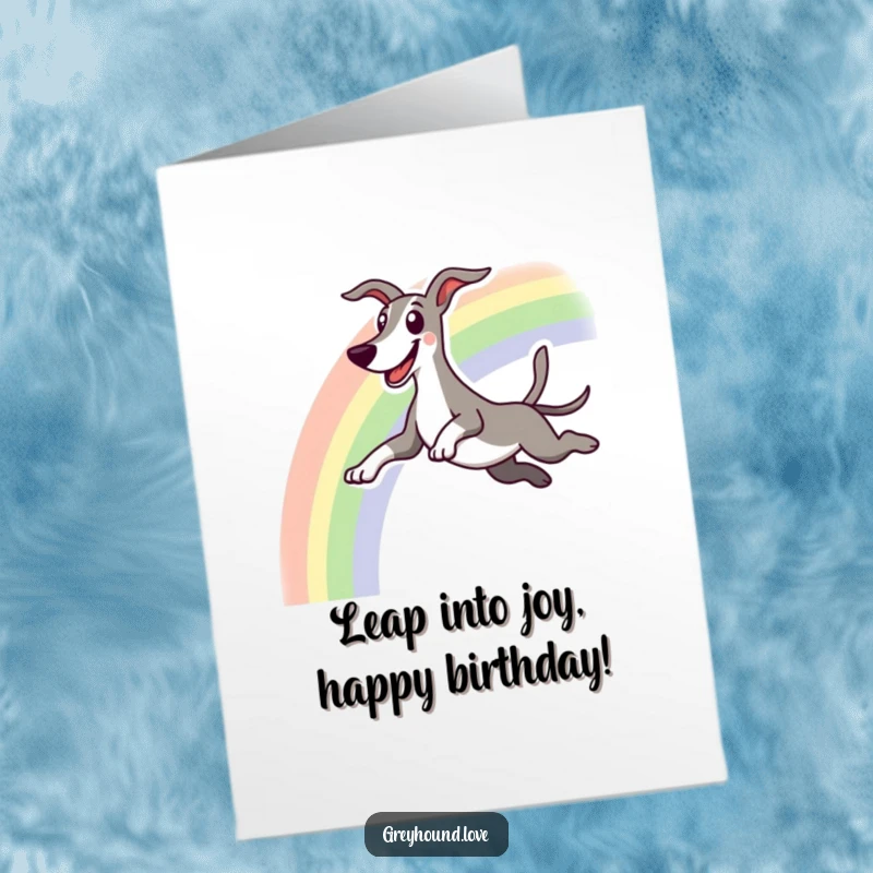 Funny free printable birthday card: An excited greyhound with a huge grin happily leaps over a bright, colorful rainbow.