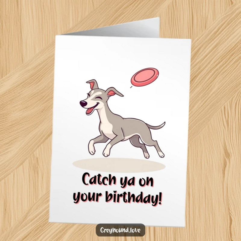 Funny Free Printable Birthday Card: Greyhound winks playfully while leaping to catch a flying frisbee.