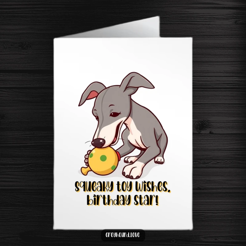 Funny Free Printable Birthday Card: Greyhound playfully nudging a squeaky toy with a joyful expression.