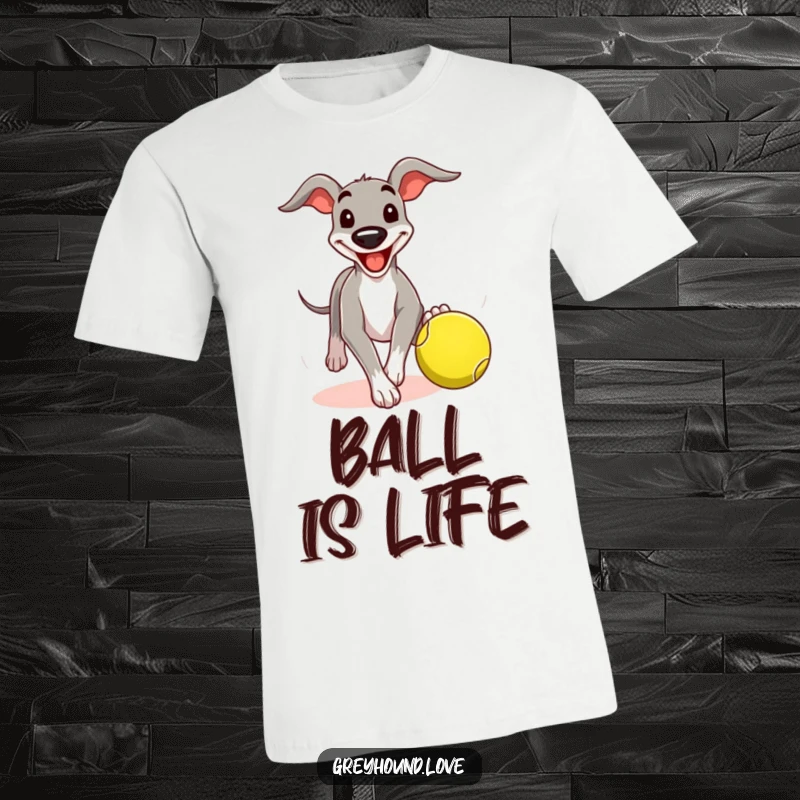 Funny greyhound t-shirt featuring a dog with a comical grin chasing a tennis ball, celebrating the joy of the chase.