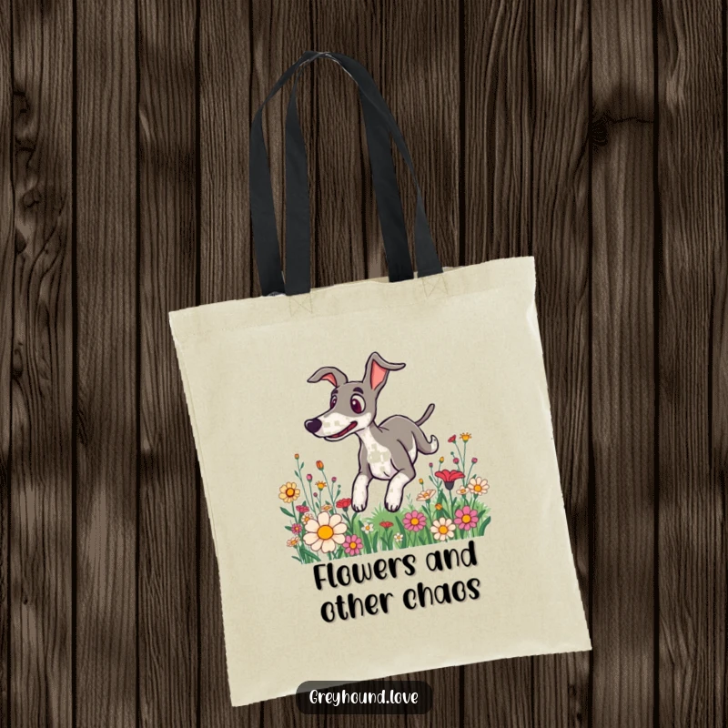 Funny tote bag displaying a greyhound with a surprised expression, tumbling through a vibrant field of flowers, perfect for errands.